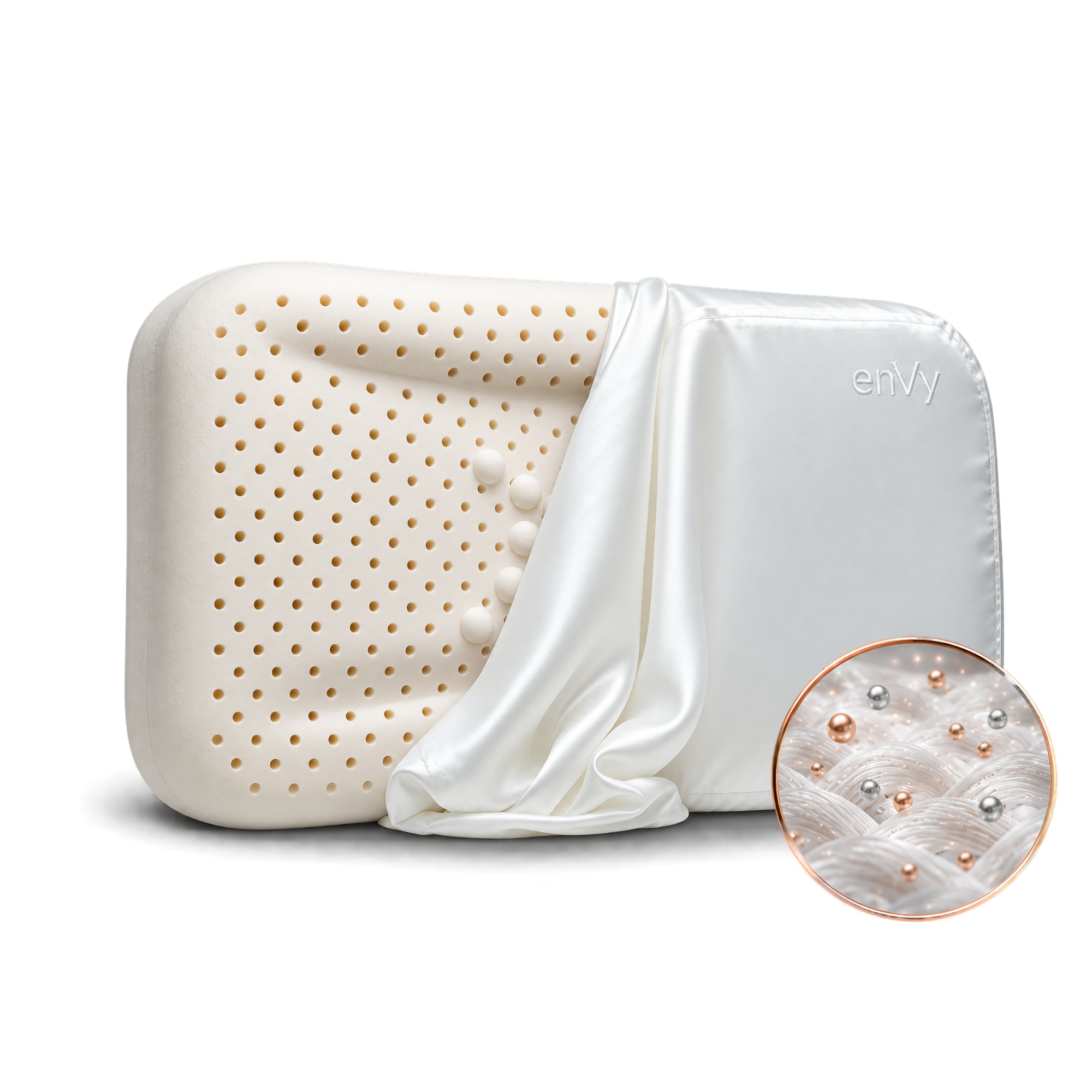 A white silk pillowcase draped over it, featuring a circular inset showing the COPPER and ZINC infused into the silk pillowcase of the enVy®  pillow