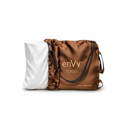 Travel size pillow inside a travel bag by enVy
